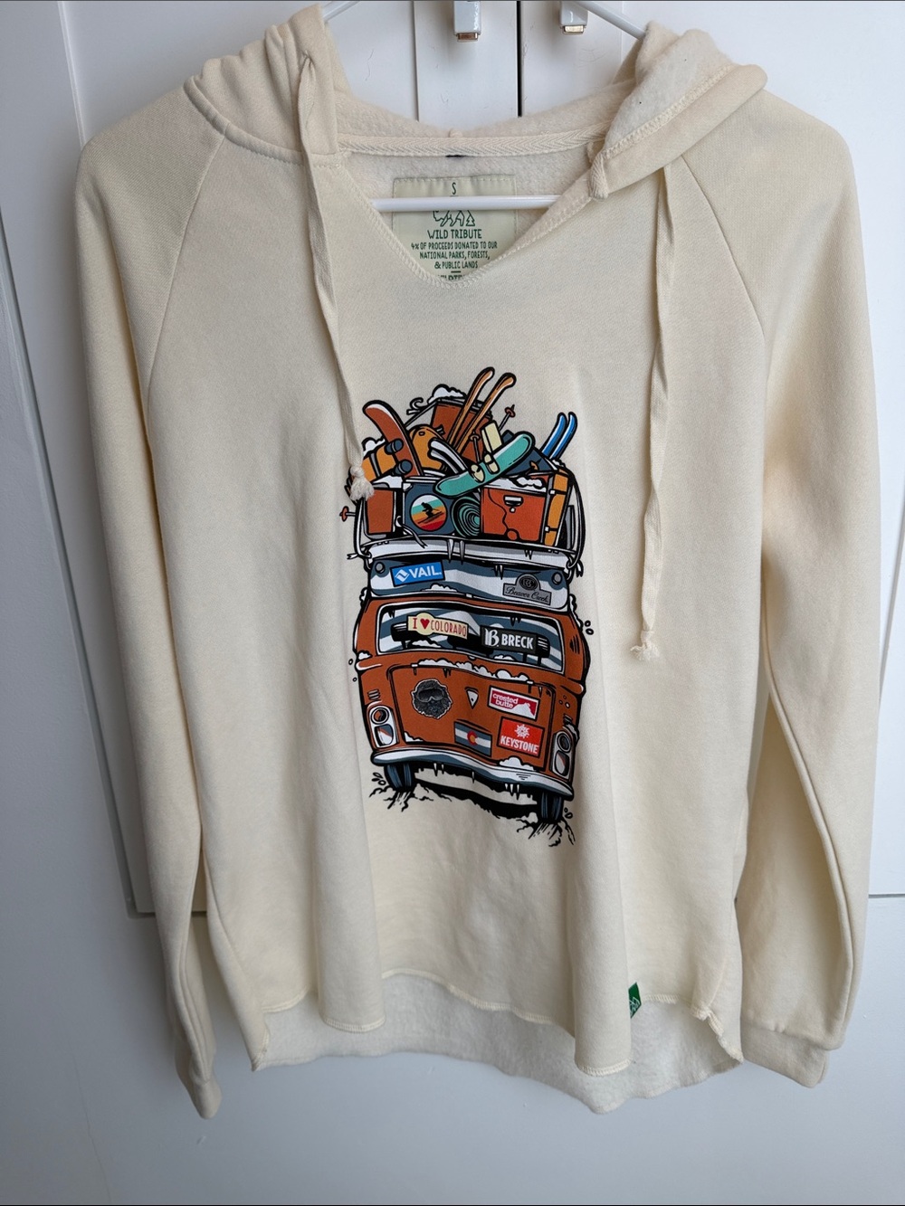 Never Worn Wild Tribute Cream Graphic Hoodie Sweater - Women's